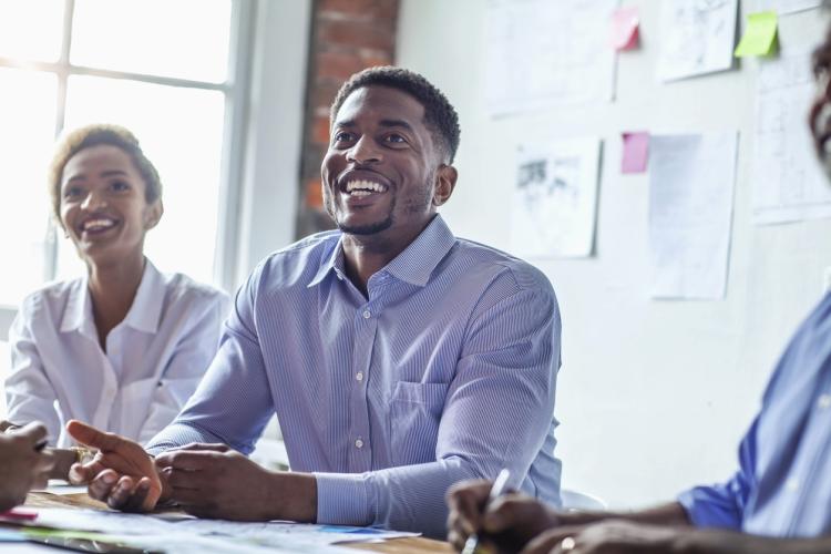 adults laughing in a classroom